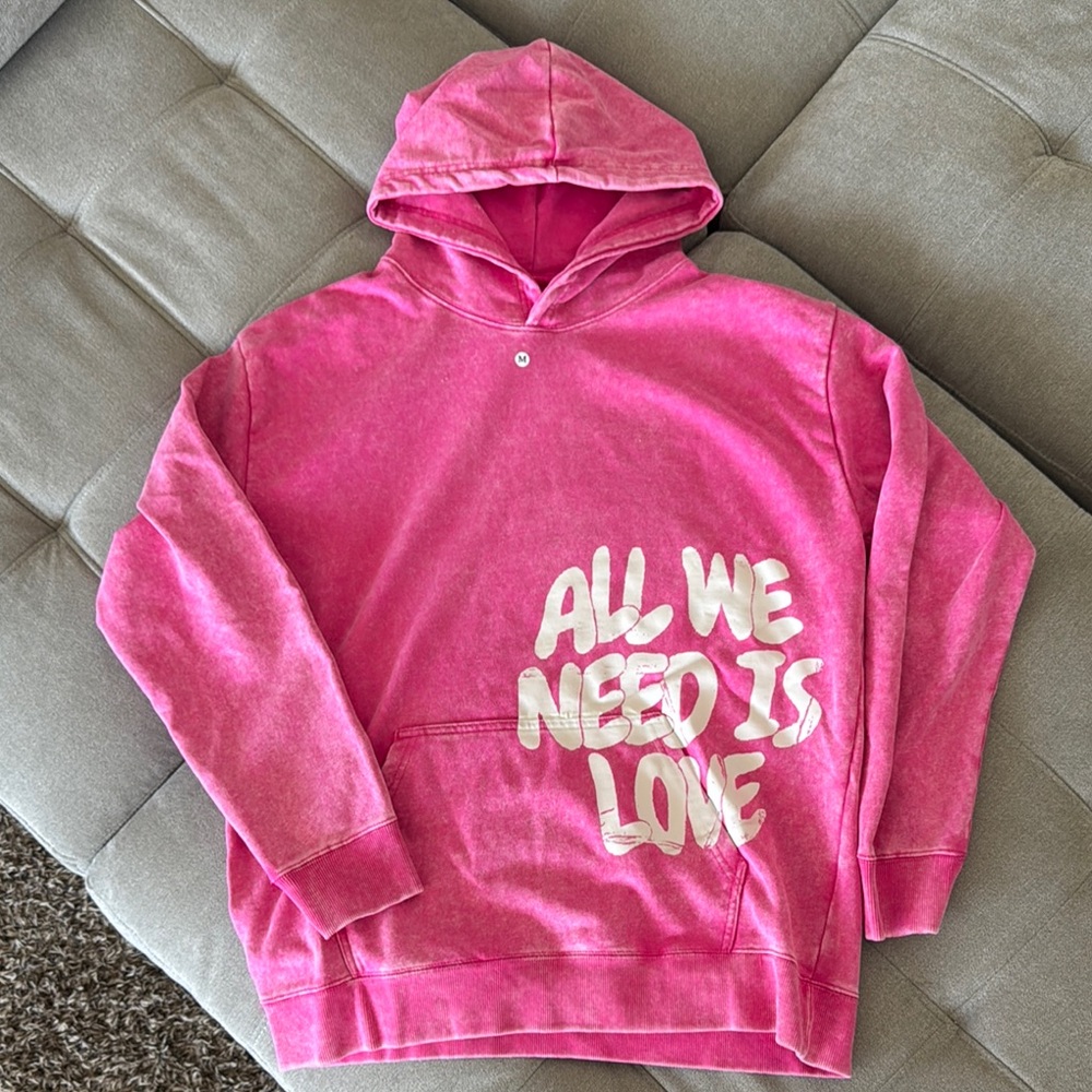 Pink Hoodie with All We Need Is Love Slogan